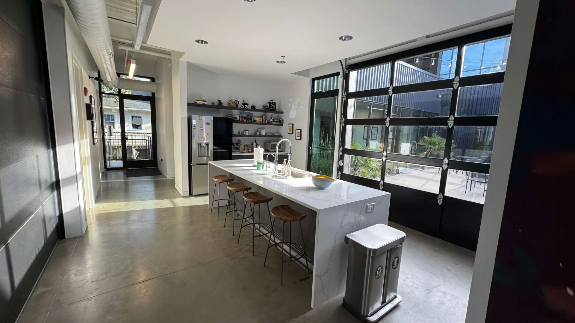 Shared kitchen with island, stools and coffee bar